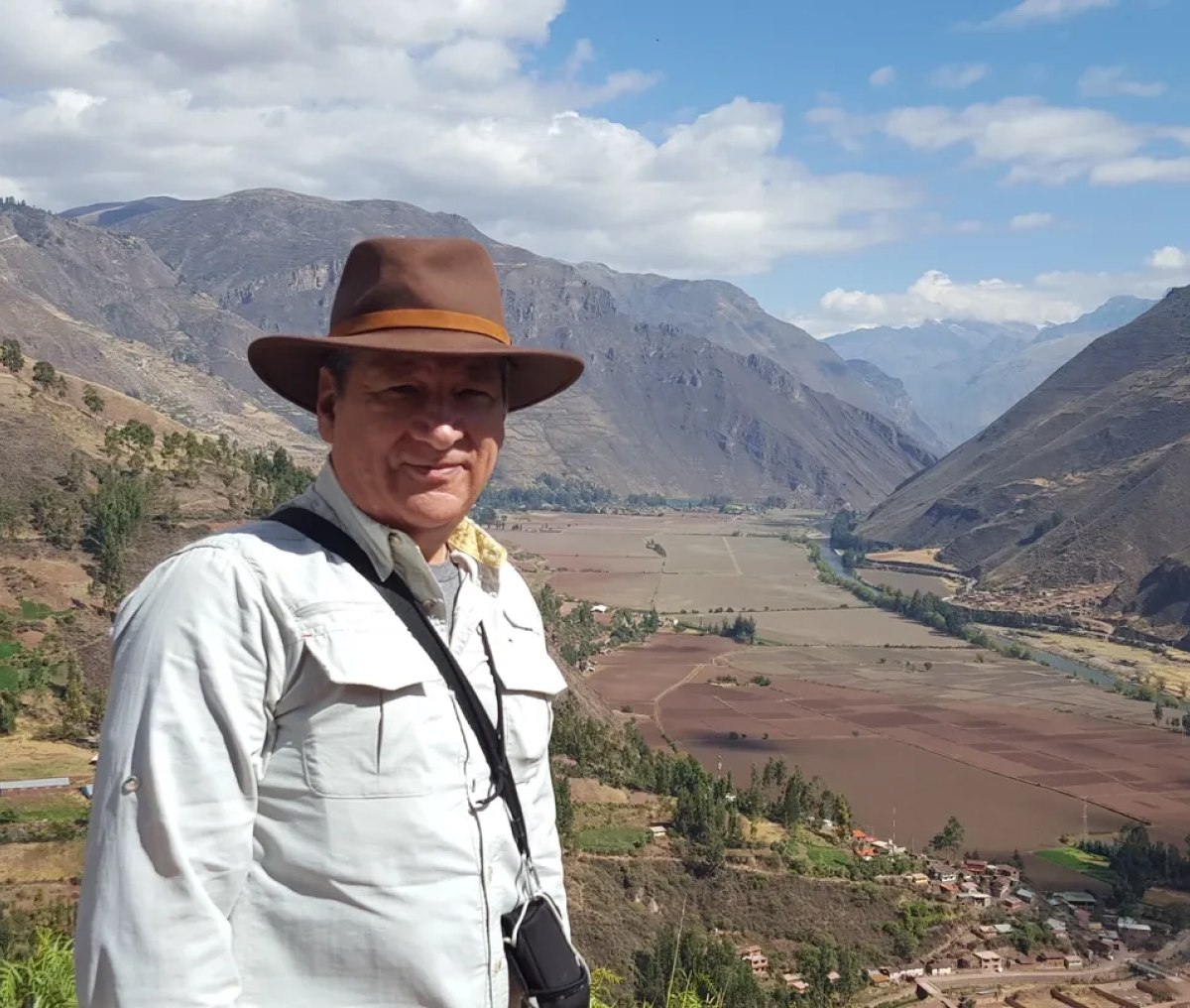 Traveler posing in mountainous landscape